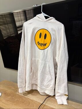 drew house cream hoodie with yellow smiley logo